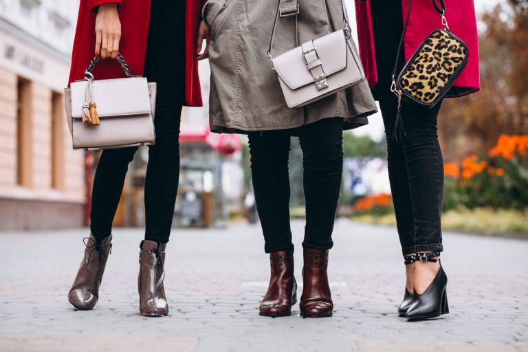 Photo of three fashionable women with purses illustrates blog: "Do Pawn Shops Take Purses?"