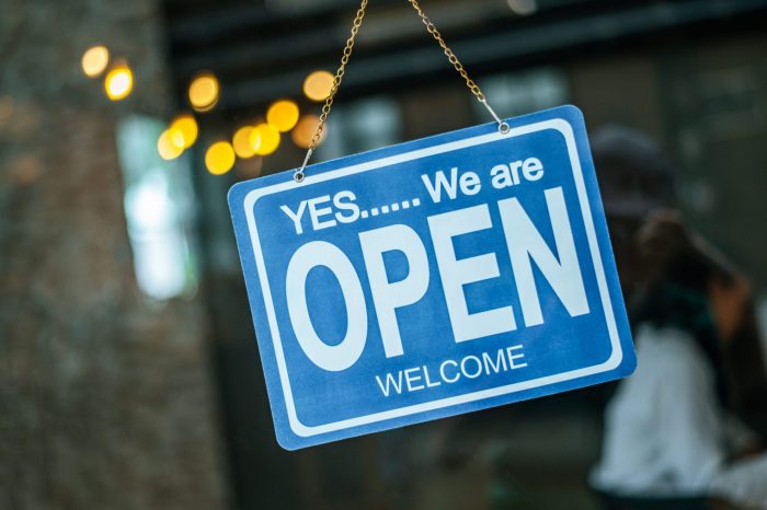 Image of sign that reads "Open" illustrates blog:; "Are Pawn Shops Open on Sundays?"