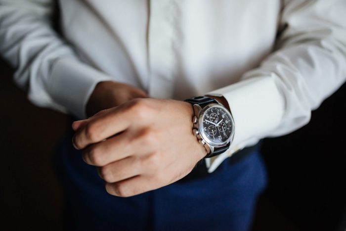 Photo of man with wristwatch illustrates blog: "Do Pawn Shops Buy and Sell Watches?"