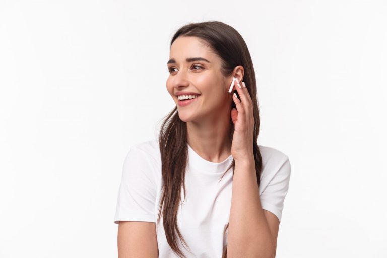 Young woman with AirPods illustrates blog "Do Pawn Shops Take AirPods?"