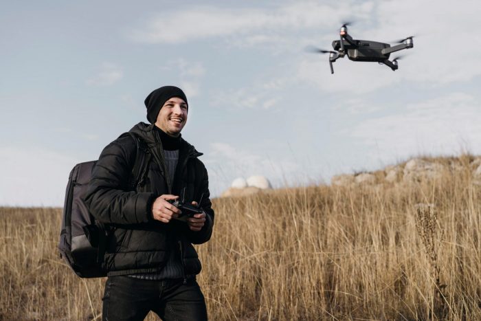 Drone Smiling man with drone illustrates blog "Do Pawn Shops Buy Drones?"