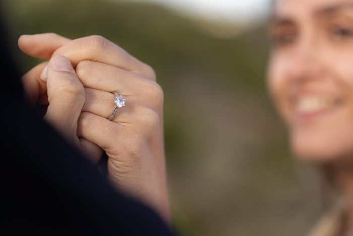 ring-FP Closeup of woman wearing ring illustrates blog "Can You Pawn Moissanite? Everything You Need to Know"