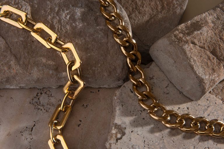 Closeup of gold necklaces illustrates blog : "Pawn Shops and Broken Jewelry: What You Need To Know"