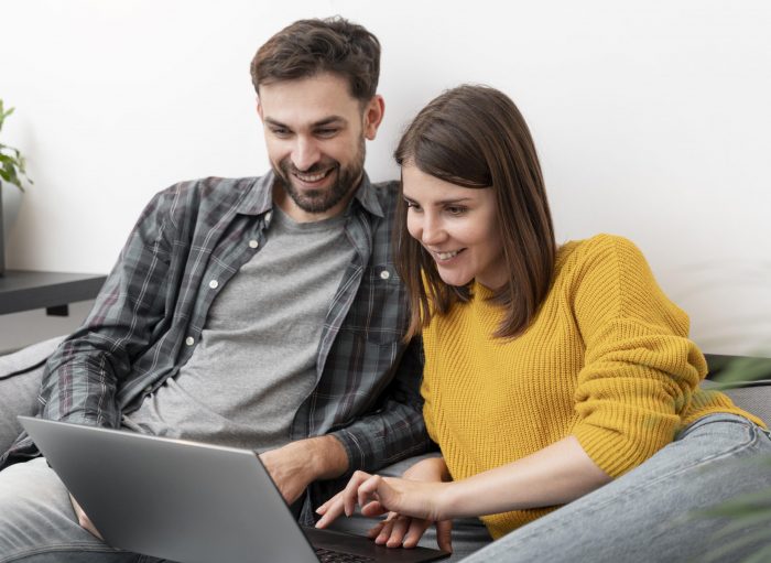 couple-laptop-fp Couple looking at laptop illustrates blog "Can You Shop Pawn Shops Online?"