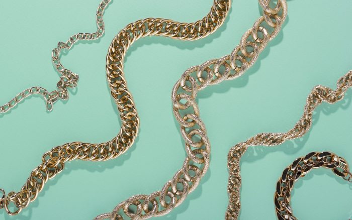 jewelry-fp Closeup of gold chains illustrates blog "To Pawn or Sell Jewelry: Which One Is Best?"