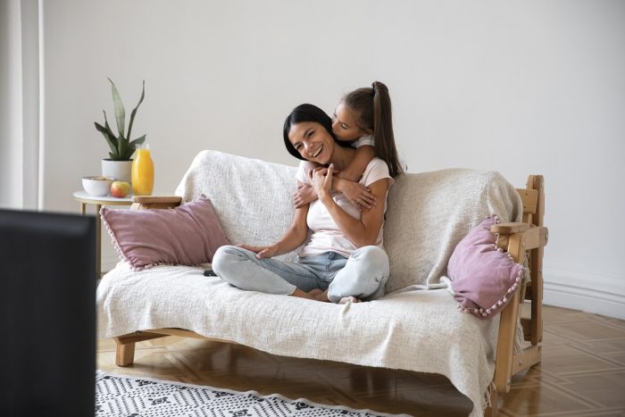 woman-girl-tv-fp Woman and little girl watching TV.