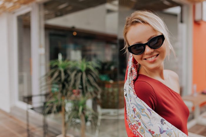 sunglasses-ansiia Smiling woman wearing designerr sunglasses.