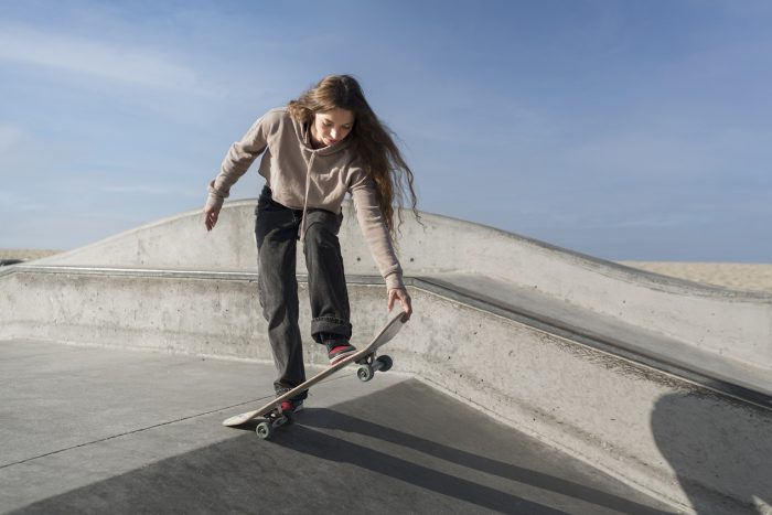 skateboard-feepik Girl with skateboard illustrates blog "Can You Pawn a Skateboard?"