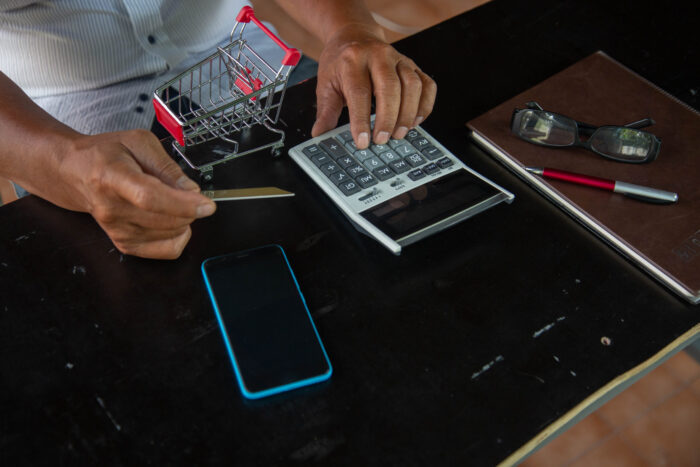 businessman using calculator tax in office.