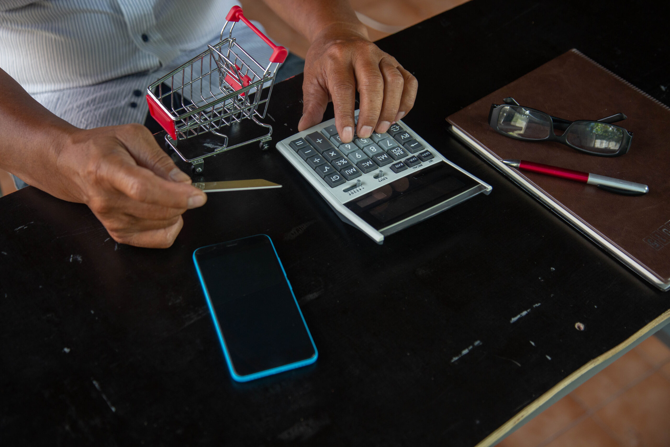 businessman using calculator tax in office.