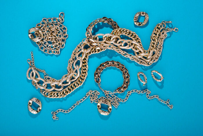 top-view-gold-chains-still-life Gold chain and loose diamond being evaluated for pawn value