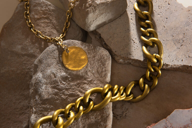 close-up inspection showing old jewelry value with gold rings and gemstones