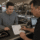 Customer learning how pawn loan interest rates work at a pawn shop